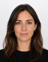 Passport-style headshot of Maya Collins, the demonstration applicant used throughout VisaOS